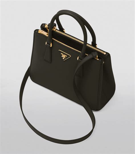 prada top handle handbags.